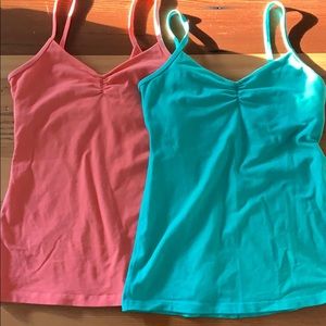 Two size 8 lululemon dance tanks aqua and coral